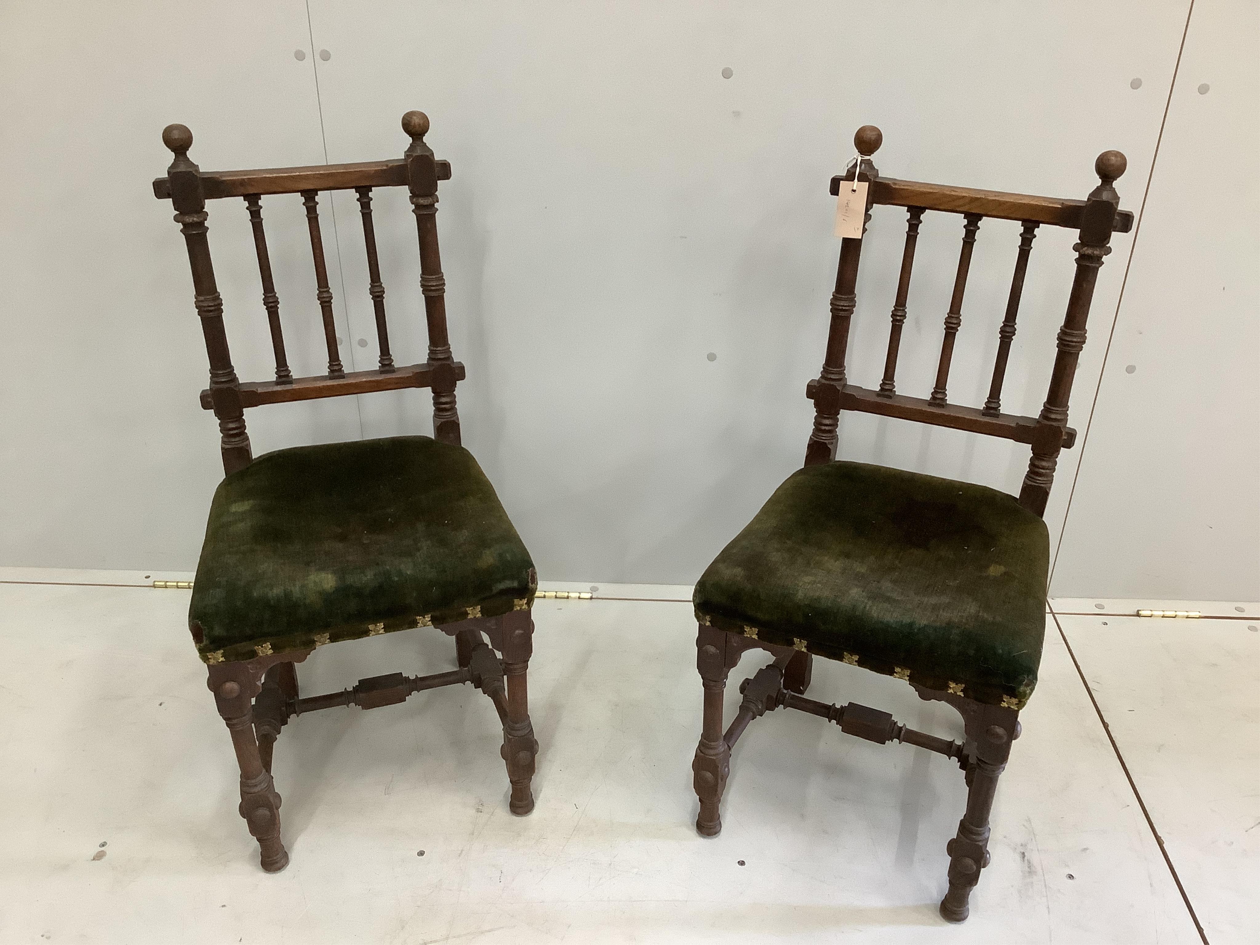 A pair of Victorian Gothic style oak side chairs